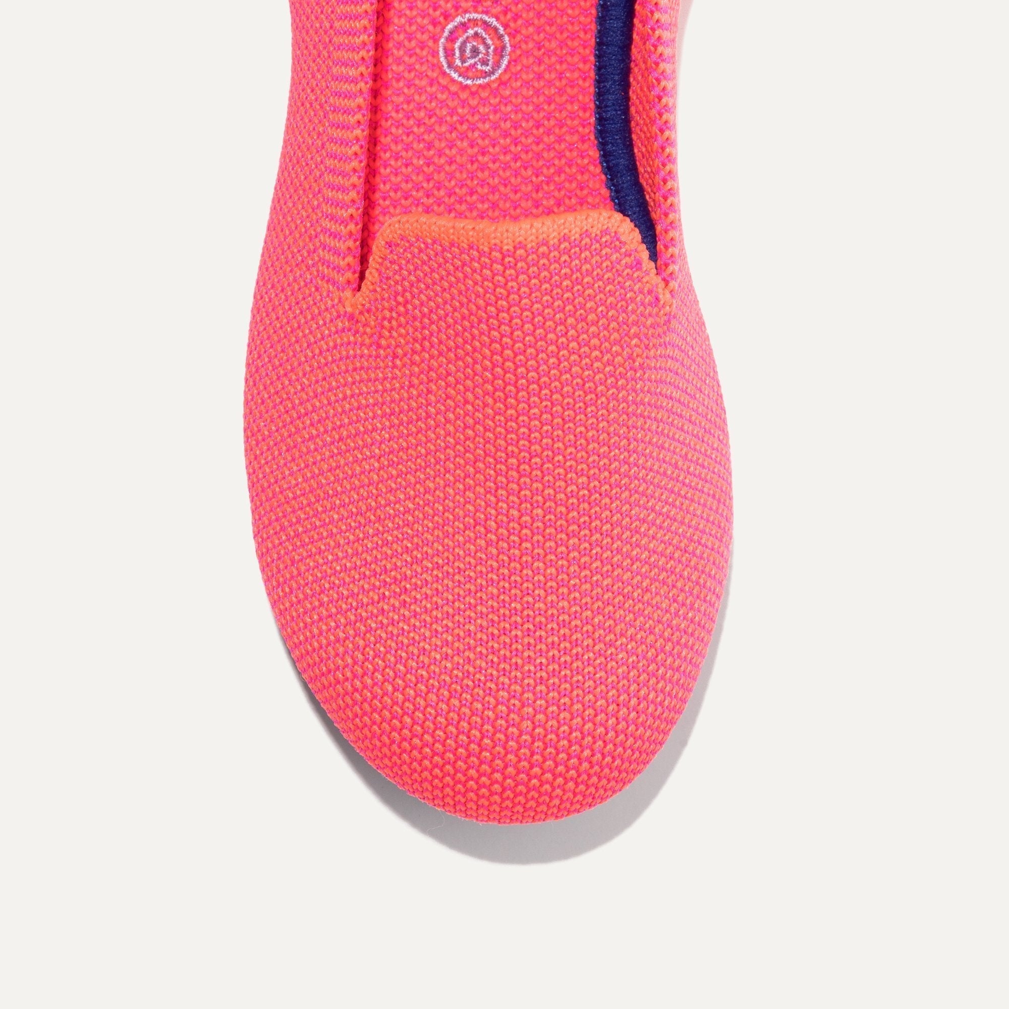 The Kids slip-on Loafer in Flamingo shown from the top view with detailing of the front of the shoe.