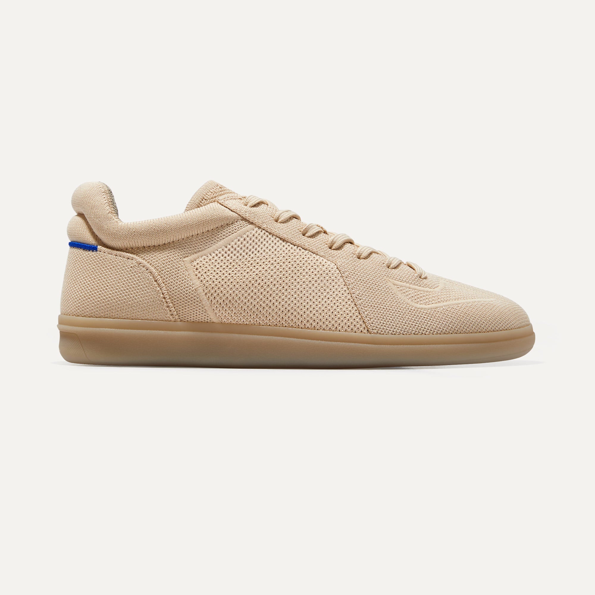 A pair of The RS01 Sneaker in Wheat shown from the side.