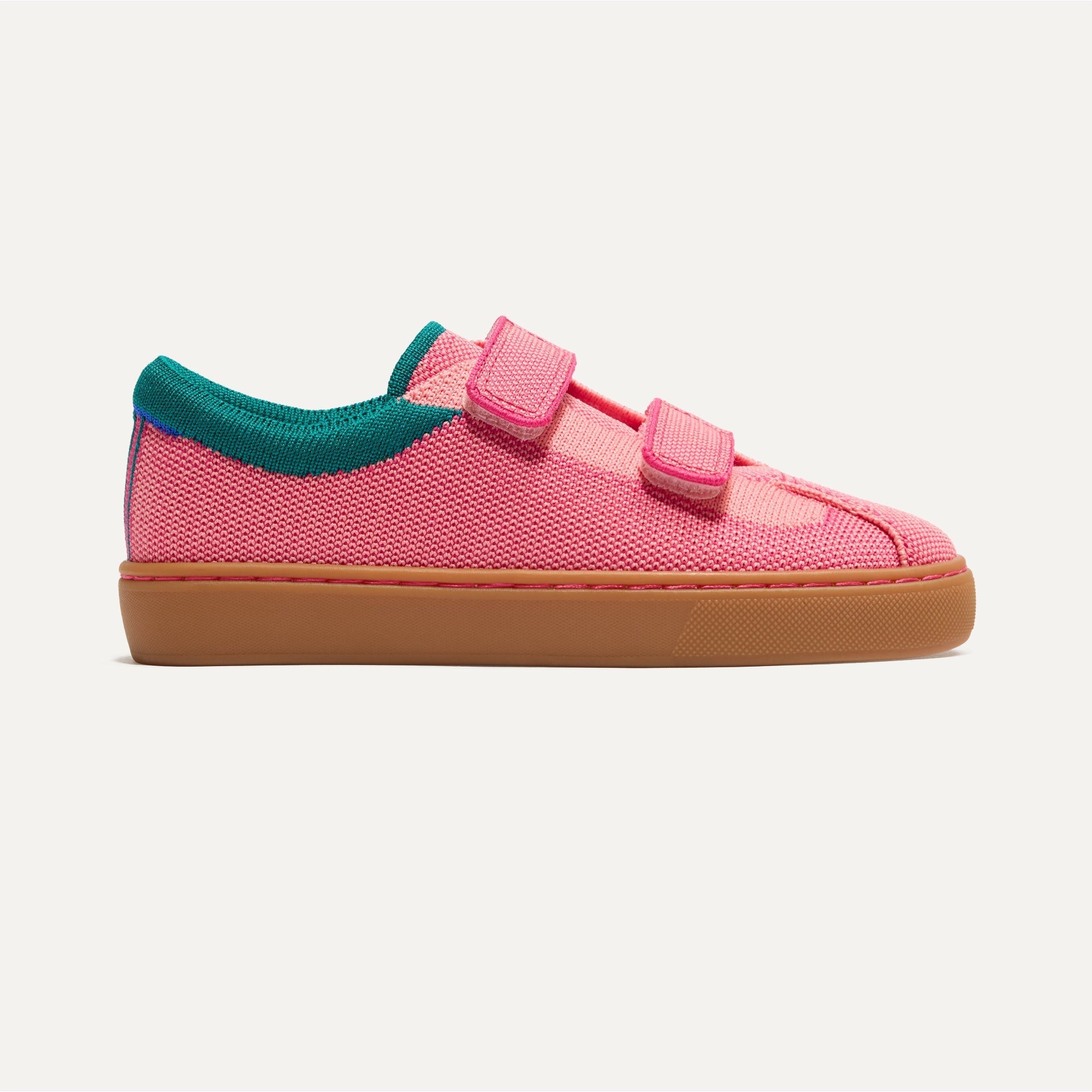 side | The Kids Strap Sneaker in Watermelon shown from the side. 