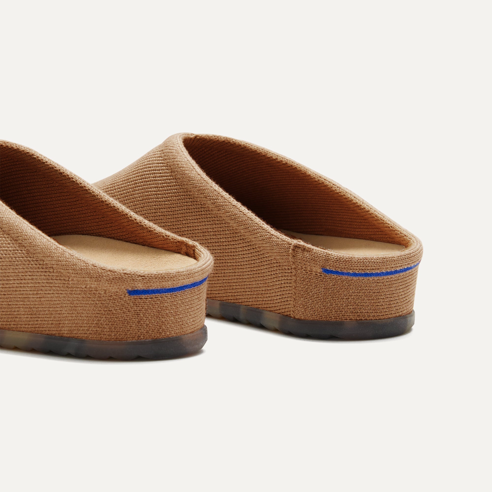 Close up of the heel of The Casual Clog in Butternut, with Rothy's signature blue halo.