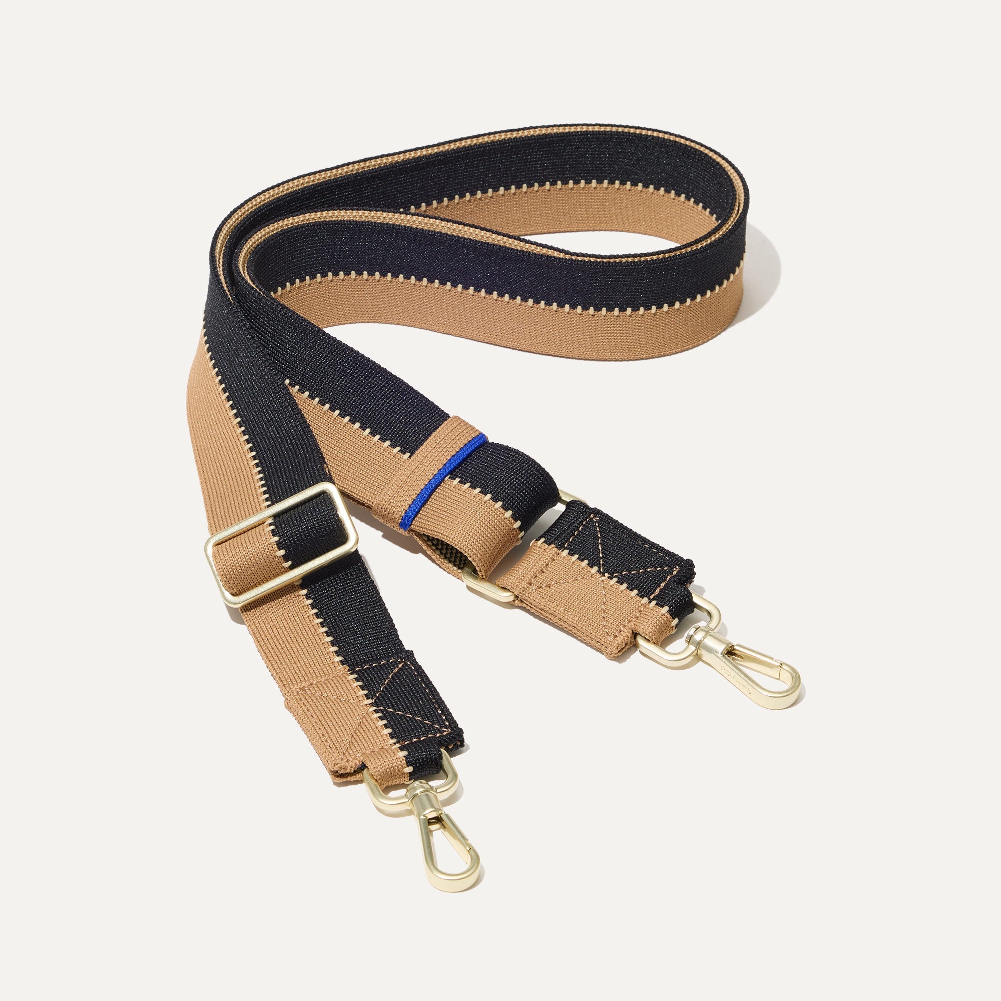 The Crossbody Strap in Grand Piano.