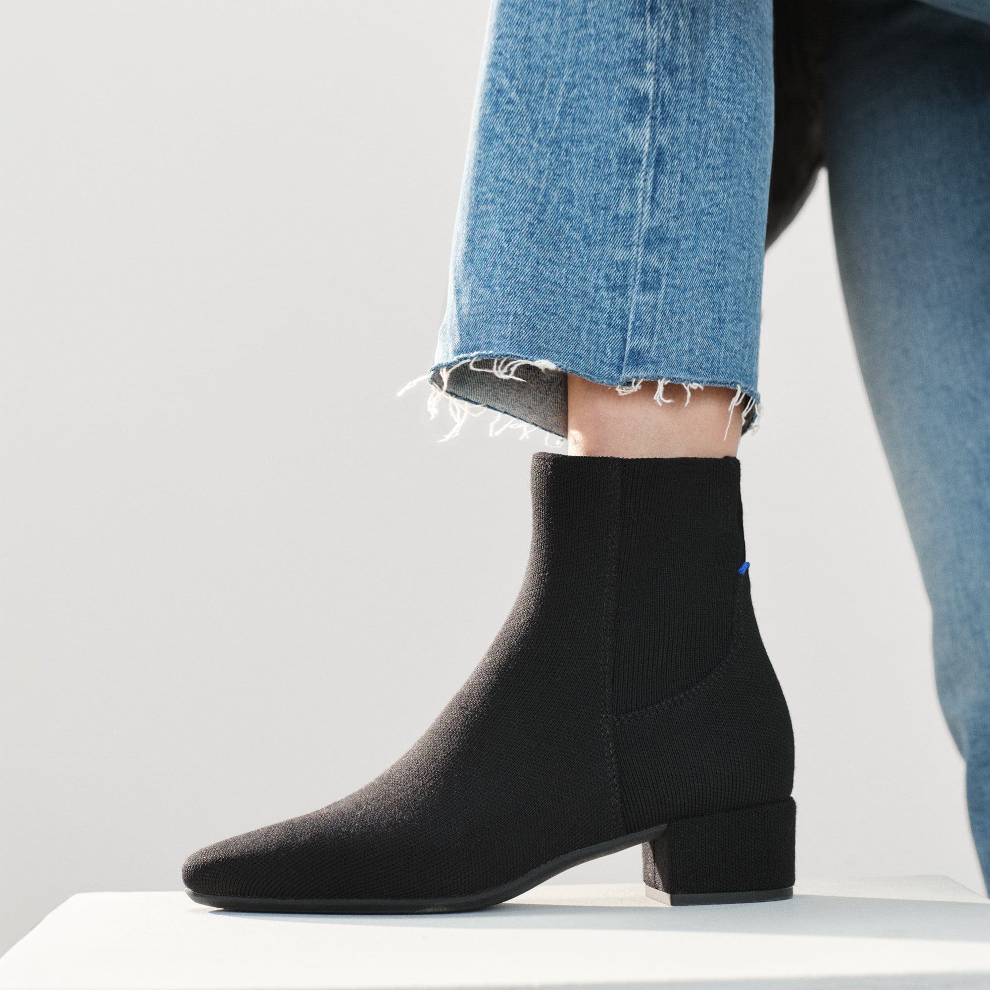 hover | Model wearing The Classic Boot in Black.