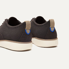 Close up of the heel of The Oxford in Deep Brown, with Rothy's signature blue halo. 