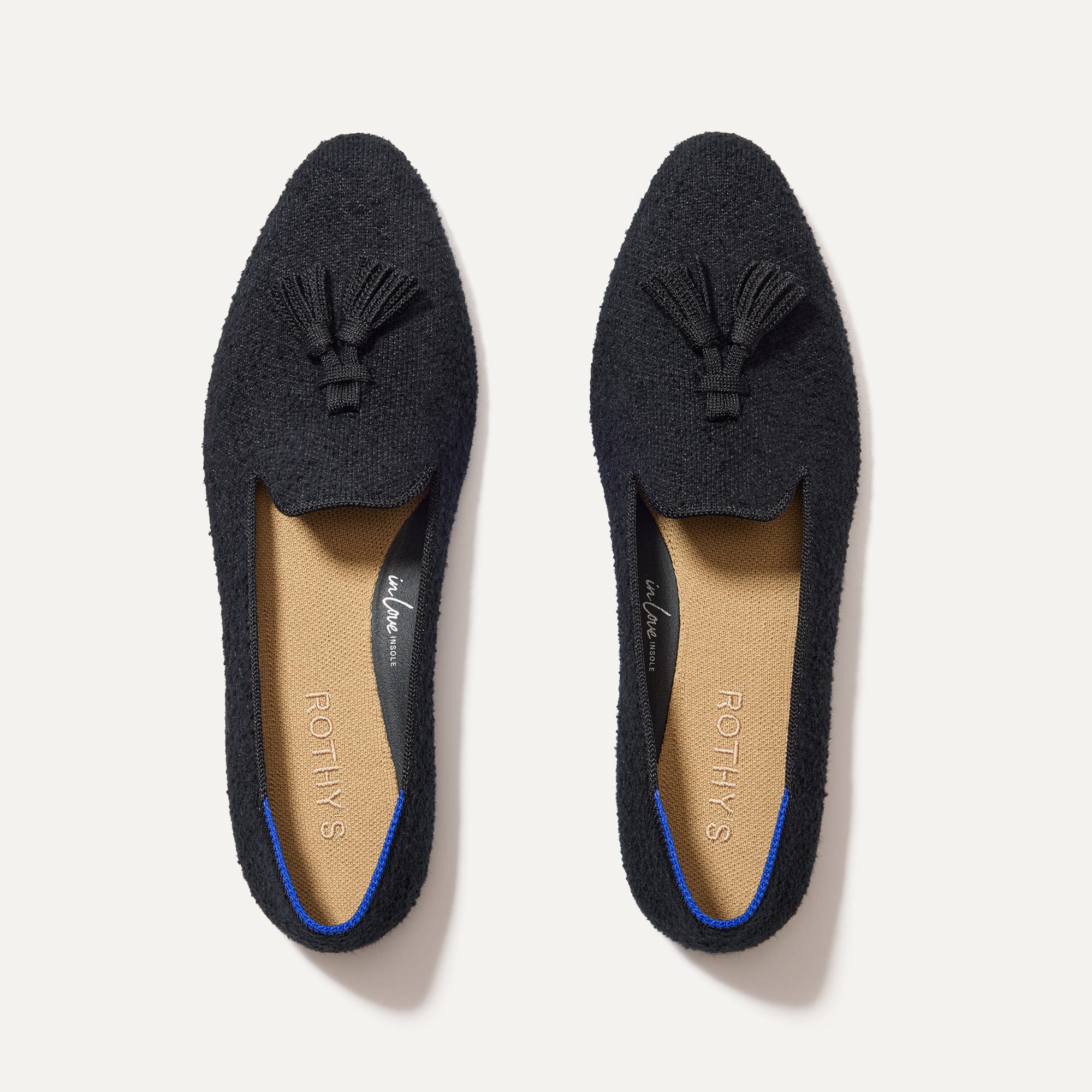 The Almond Tassel Loafer in Black Bouclé shown from the top. 