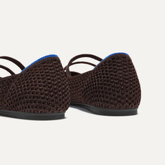 Close up of the heel of The Double Buckle Mary Jane in Chocolate Mesh, with Rothy's signature blue halo.