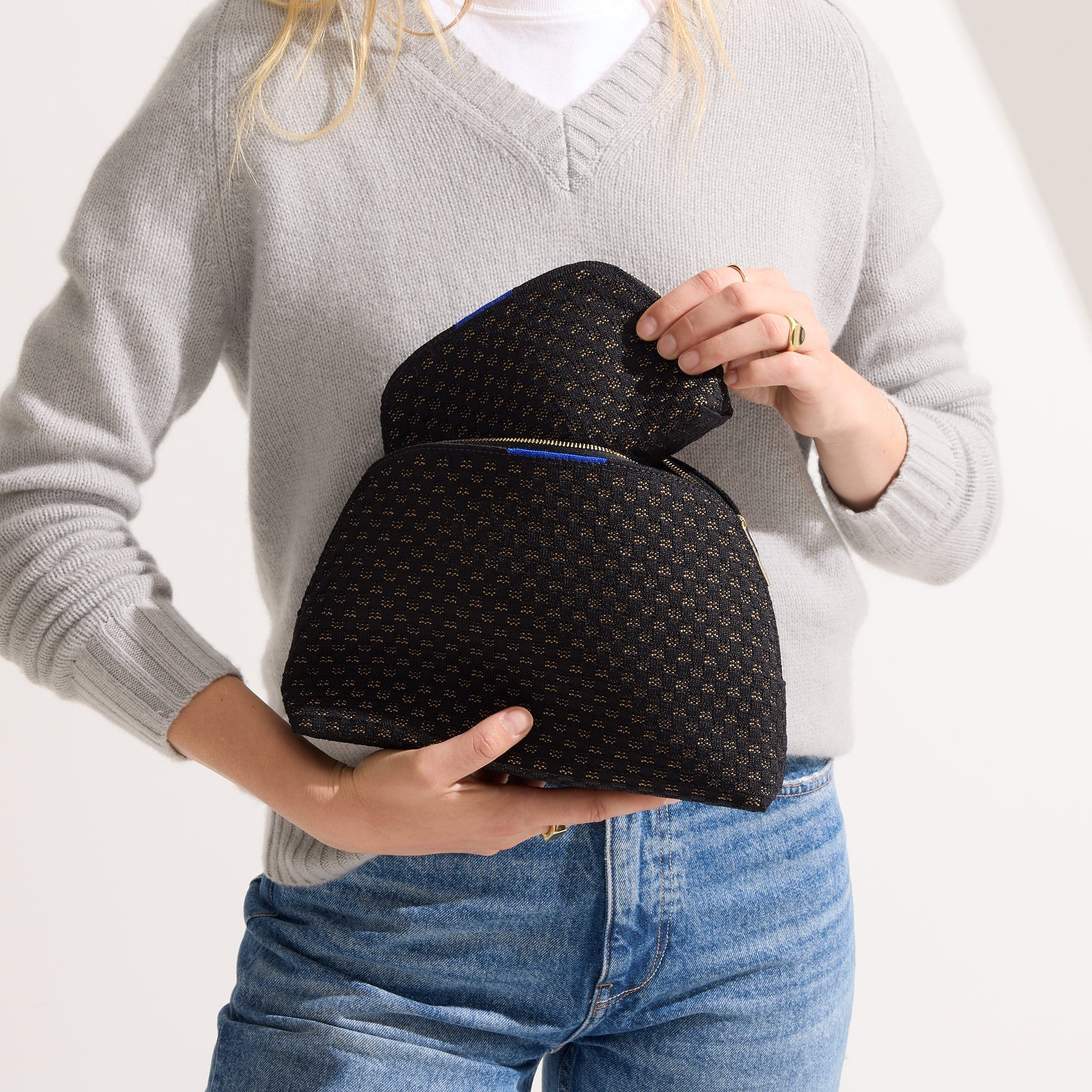hover | Model shown holding the large and small pouch of The Vanity Set in Night Song.