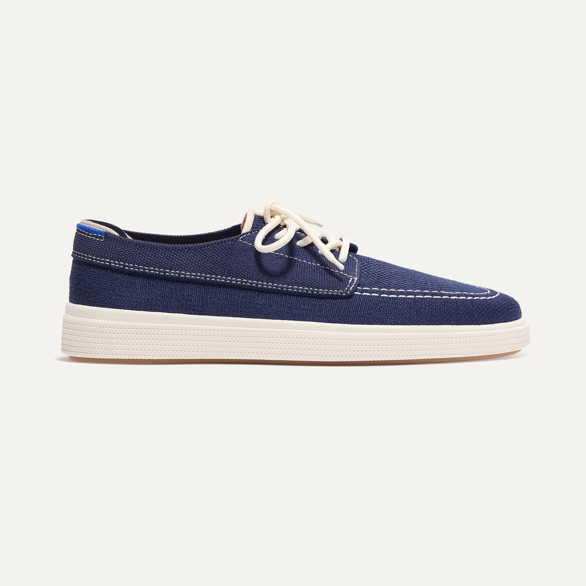 The Ravello Boat Shoe in Nautical Navy shown from the side. 