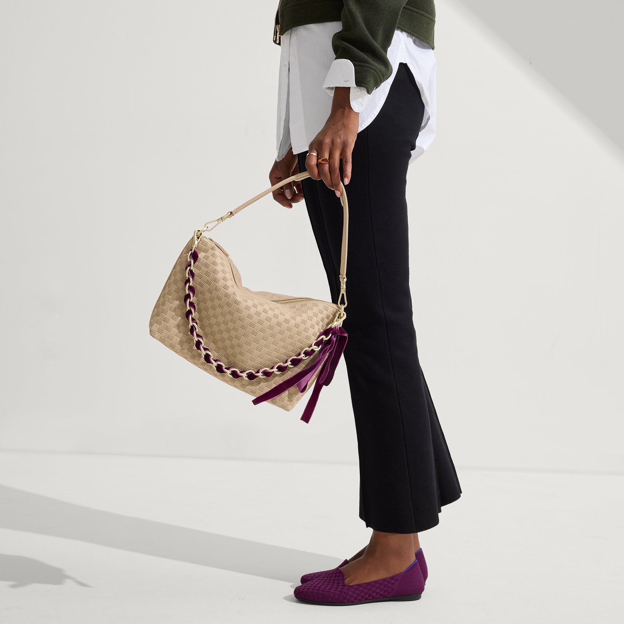 The Shoulder Strap in Velvet Plum Chain, shown paired with The Daily Crossbody, worn by a model and shown from the side. 