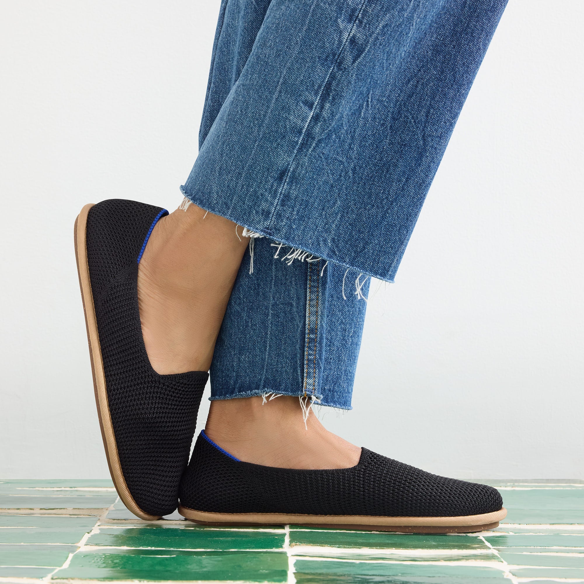hover | Model wearing The Cruiser Loafer in Black Raffia-Knit.
