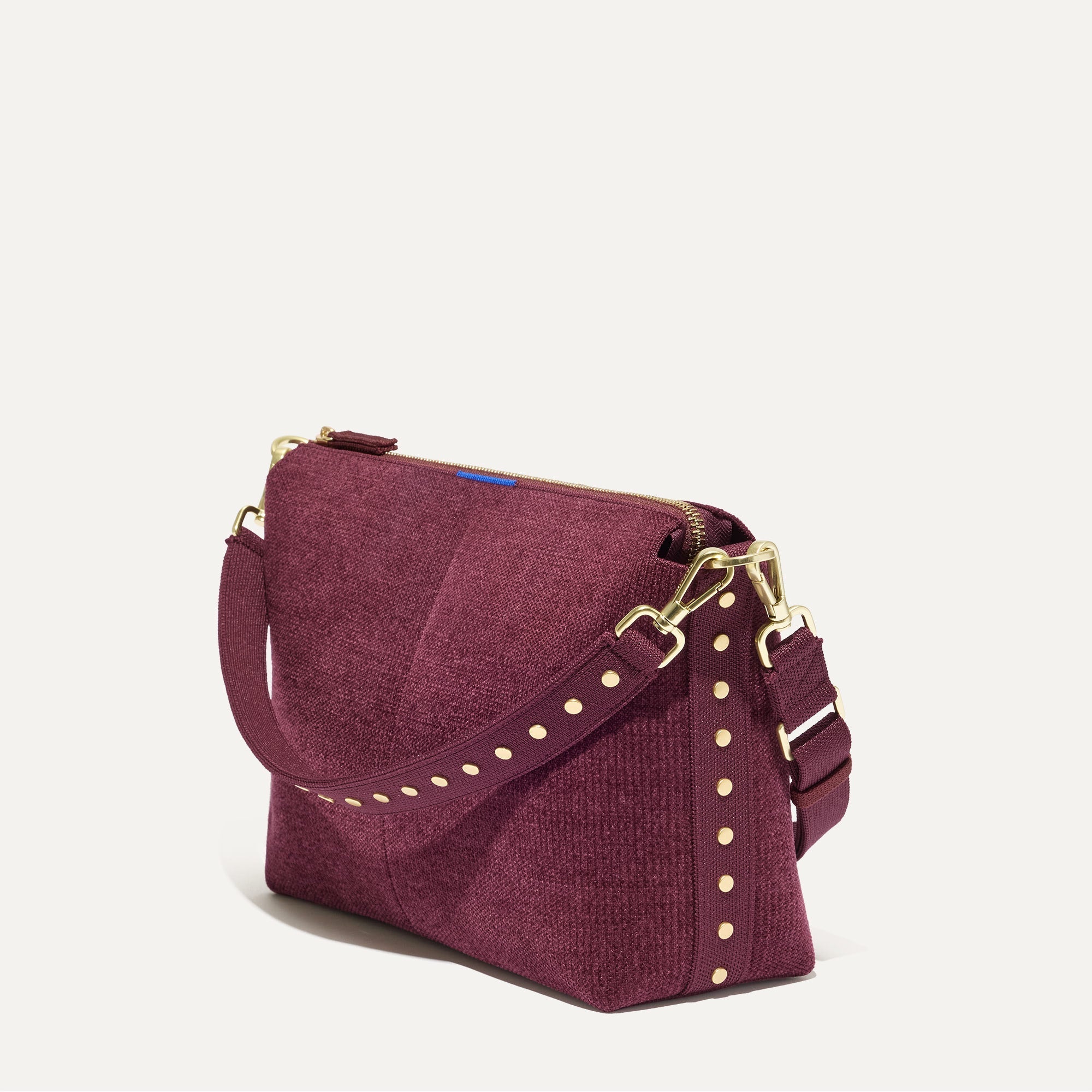 The Daily Crossbody in ReVelvet™ Syrah, shown at a diagonal view from the left.