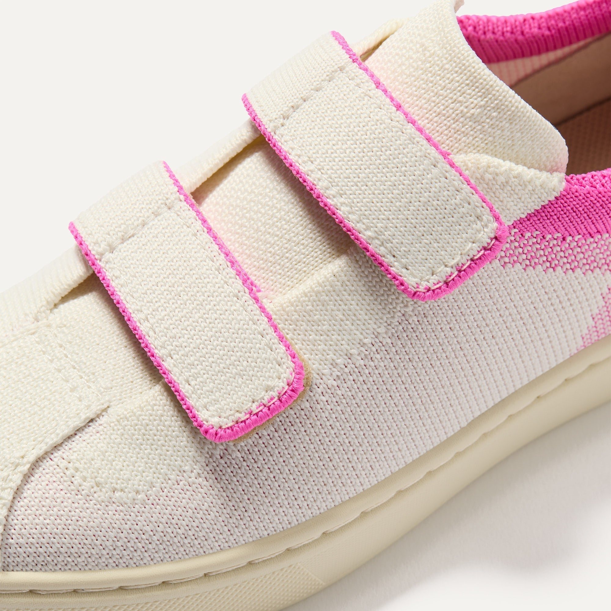 Close up of the vamp of The Kids Strap Sneaker in Pink Taffy. 