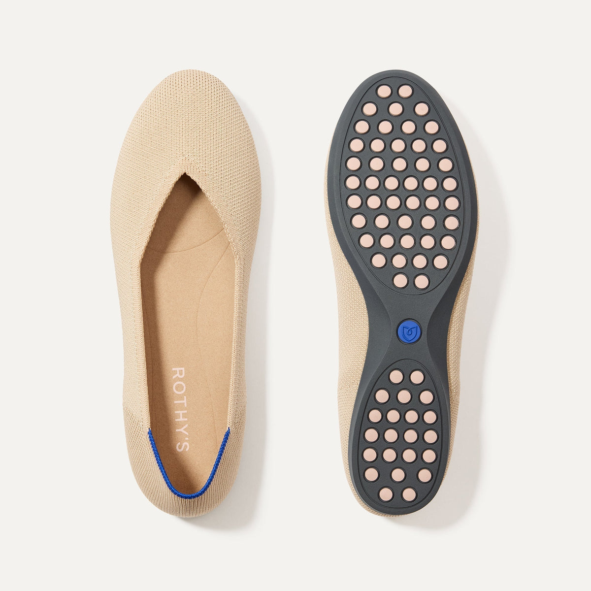 PLP |The Daily Flat in Ecru shown from the top with one shoe showing the outsole. 