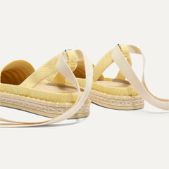 Close up of the heel of The D'Orsay Espadrille in Sunshine Stripe, showing removable ankle straps.